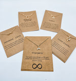 Picture of 4 positivity inspired necklaces with message cards.