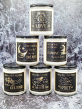 Affirmation candles with gold foil affirmation labels.