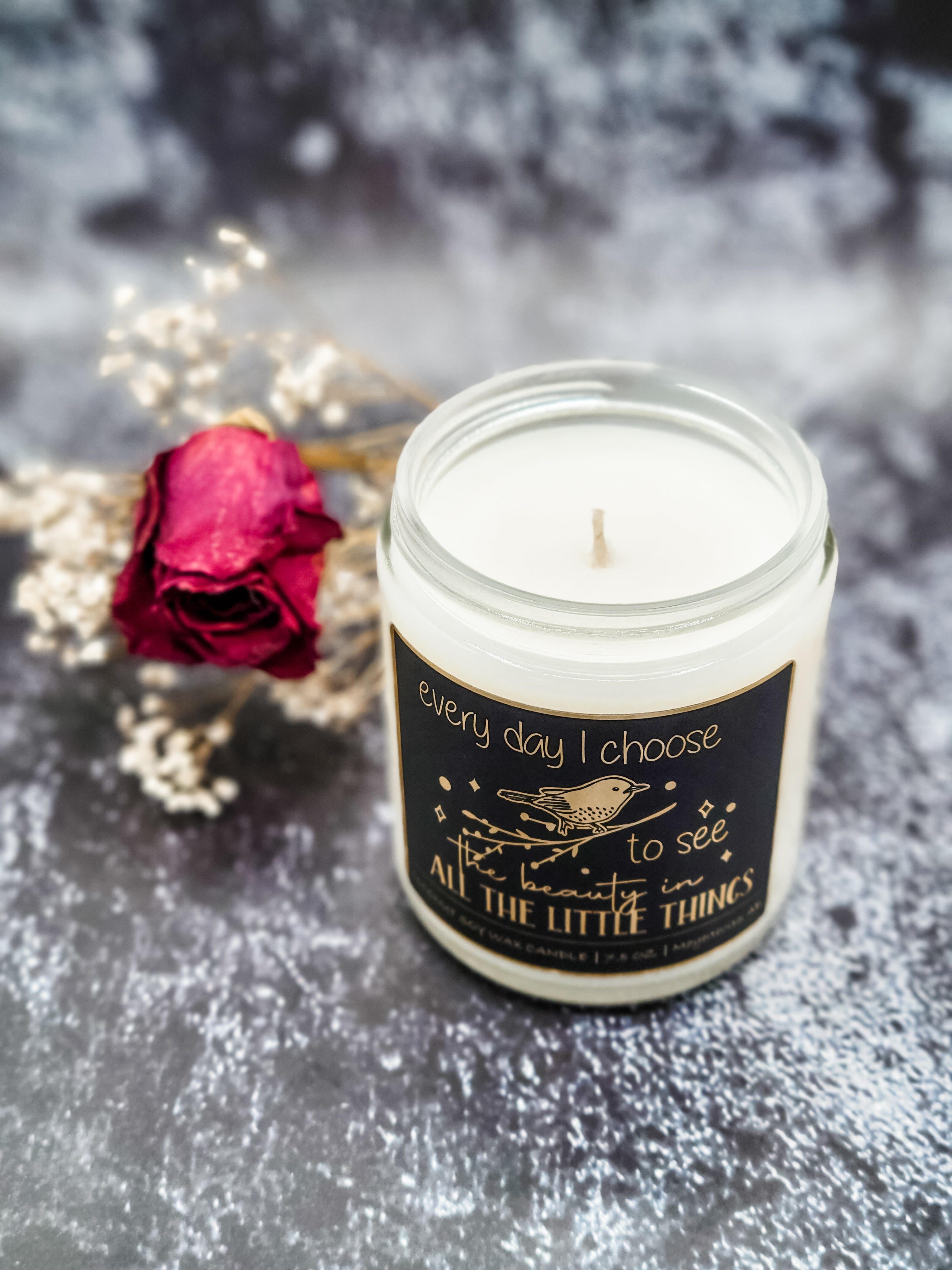 Affirmation candles with gold foil affirmation labels.