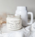 Champagne Delight scented coconut soy candle, with wood wick. Scented with notes of Berries, apple and floral lily.