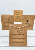 Picture of 4 positivity inspired necklaces with message cards.