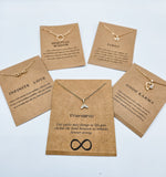 Picture of 4 positivity inspired necklaces with message cards.