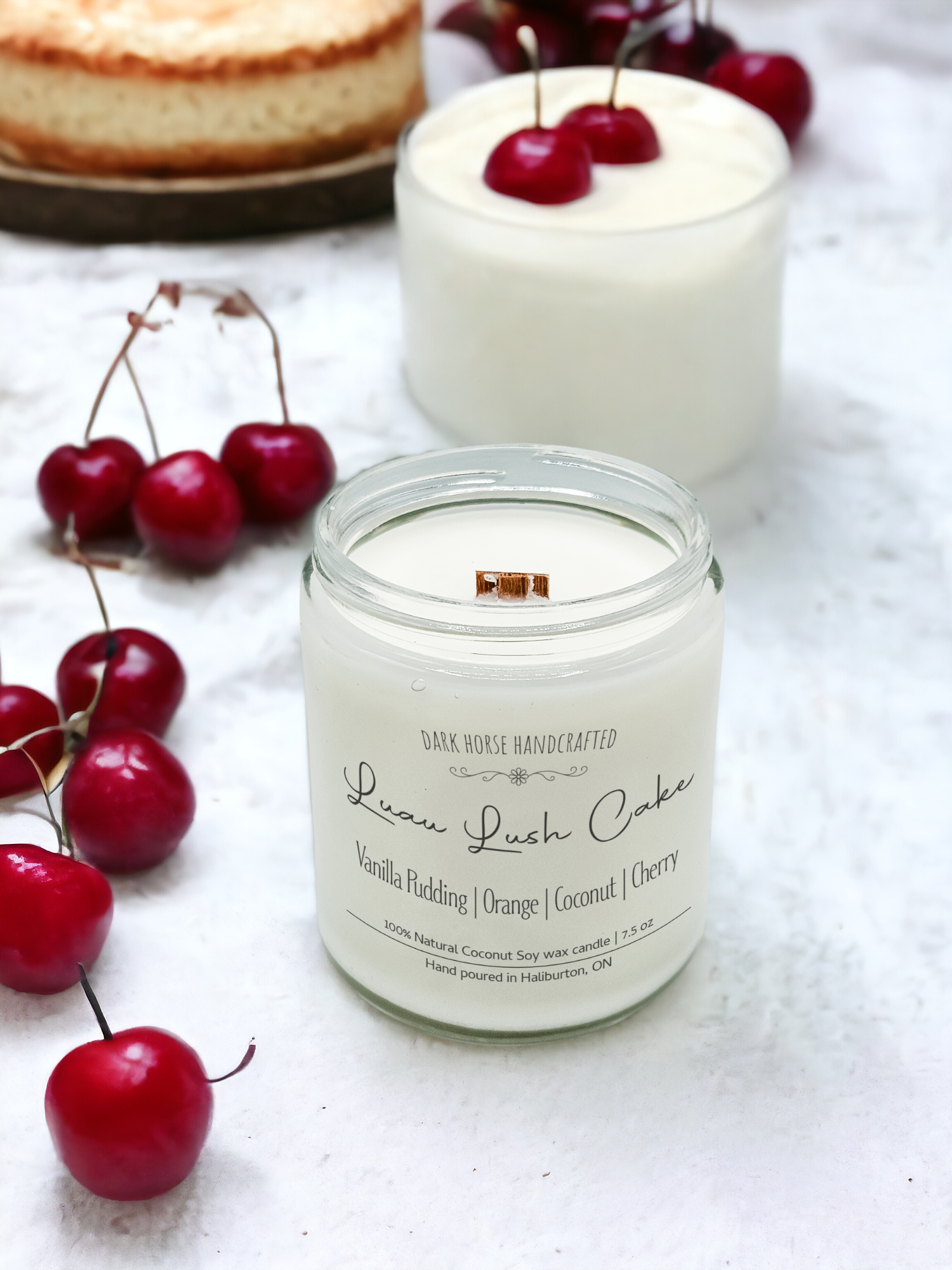 Luau Lush cake candle with cake and cherries in background - eco-friendly